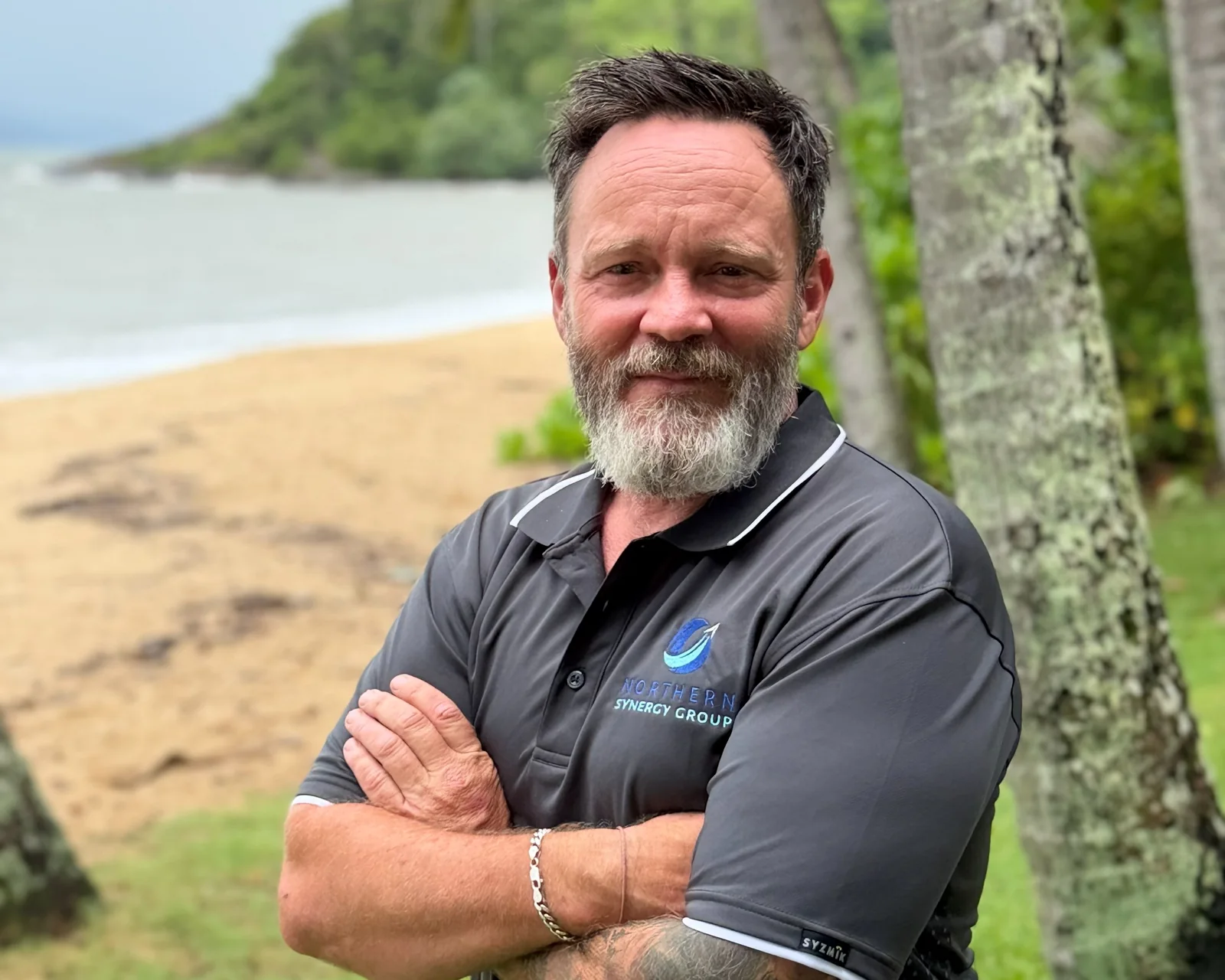 Northern Synergy Group owner in branded workwear on the Far North Queensland coast